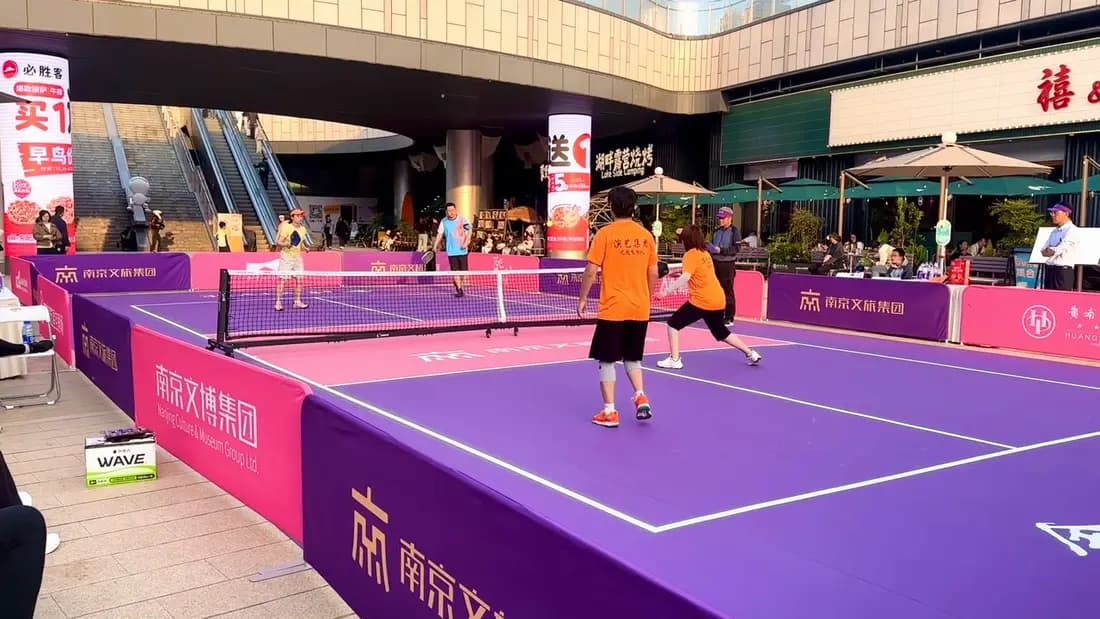 Doubles match on an outdoor pickleball court